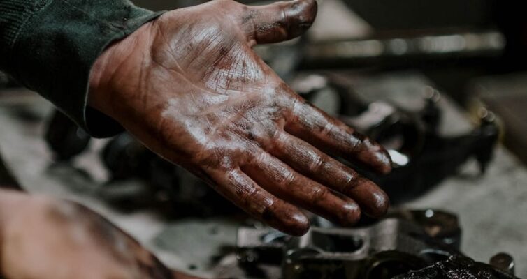 hands dirty of engine grease