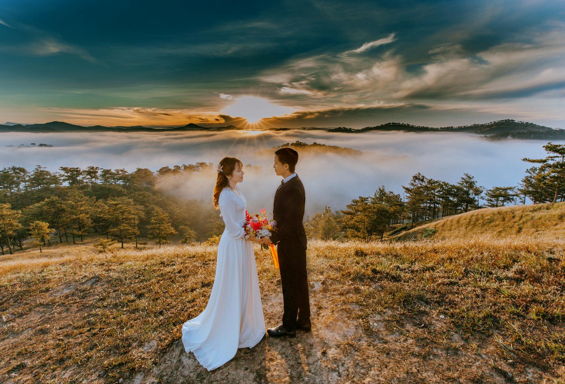 woman and man standing near the cliff