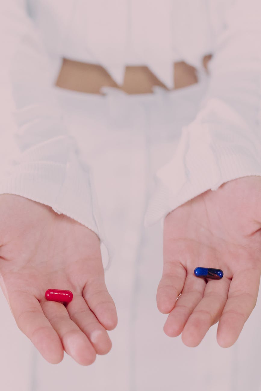 woman holding and showing pills