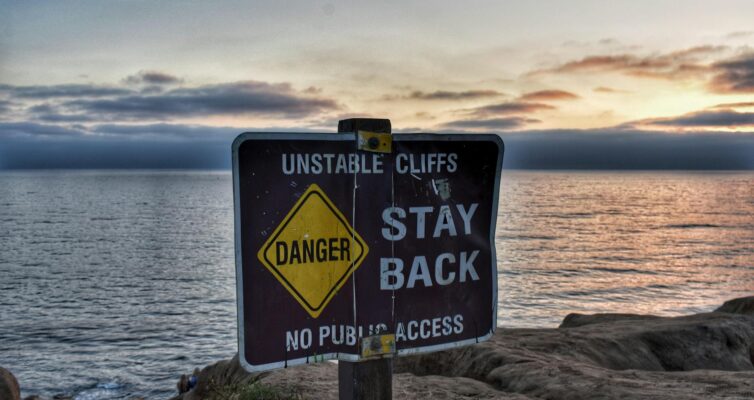 danger stay back signage